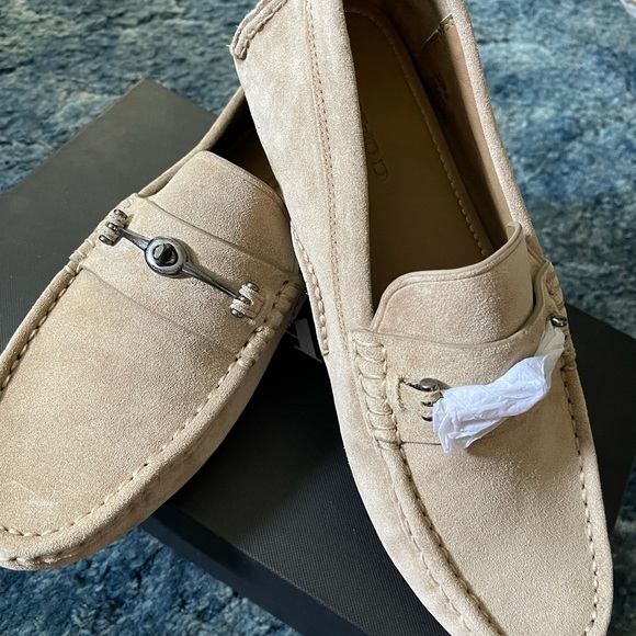 Coach turnlock driver men’s slip-ons